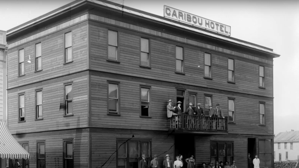 A black and white photo of the old three story Caribou Hotel