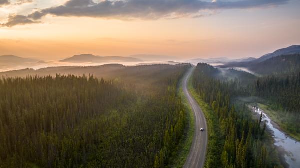 Alaska highway under midnight sun