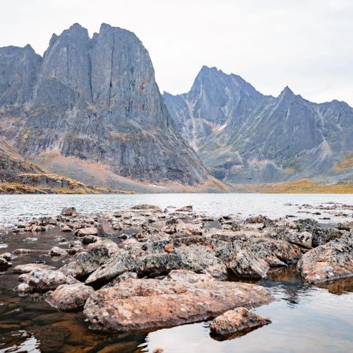 Large mountain and rocks by a lake