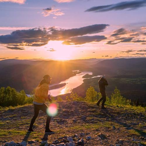 Friends bask in the sun at the Midnight Dome, Dawson City