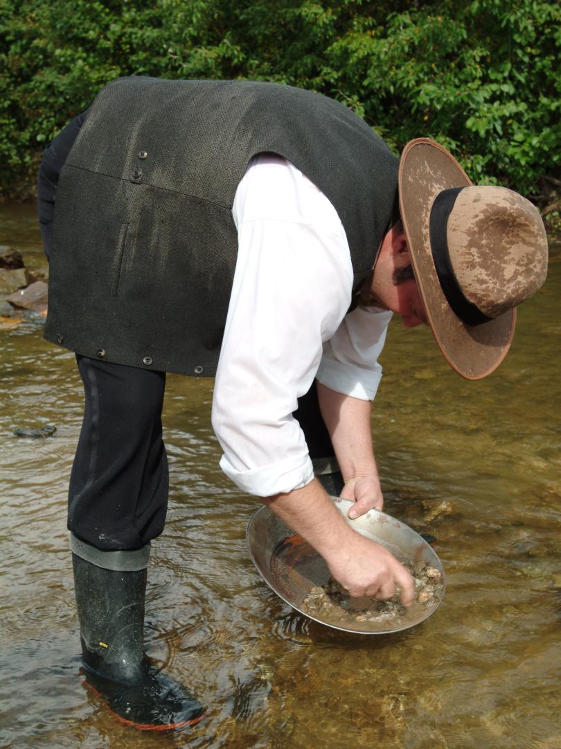 A person panning for gold in Free Claim #6 in Dawson City