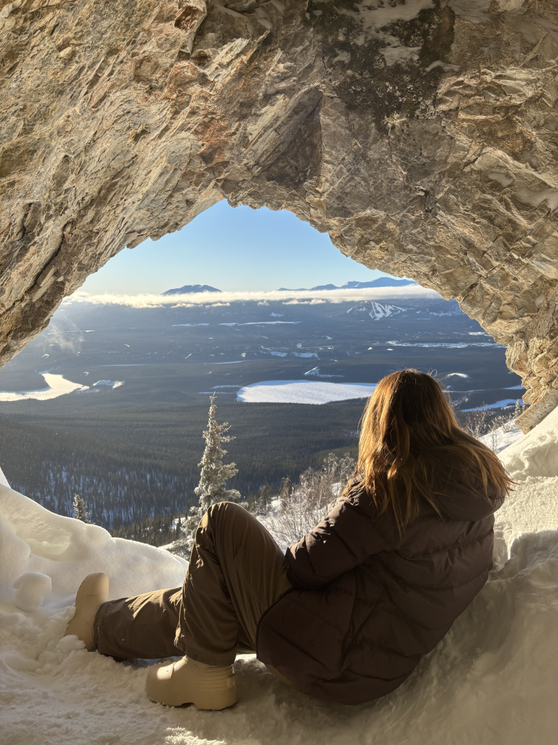 A women looking to whitehorse from the hidden cave