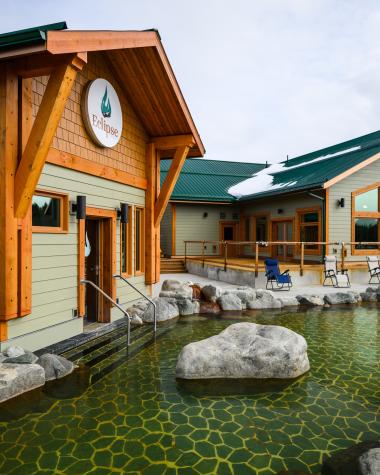 Eclipse Hot Springs buildings surrounded by rocks and water of the springs