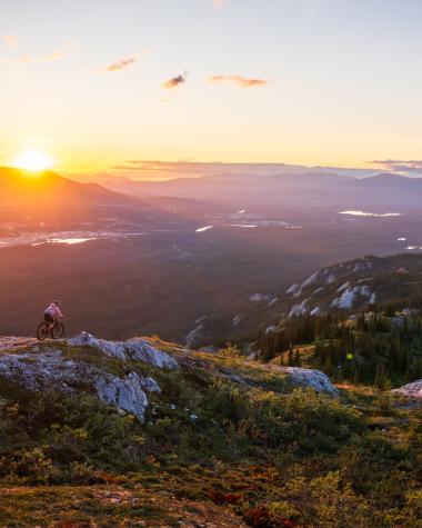 Sunset mountain biking on alpine singletrack on The Dream trail in Whitehorse.
