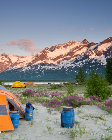 camping in the summer among tents and mountains